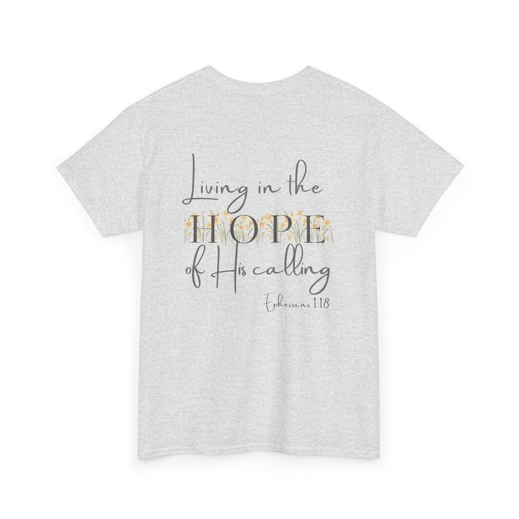 Ash Gray Back of Christian t-shirt displaying the phrase "Living in the Hope of His Calling" with floral daffodil artwork and Ephesians 1:18 scripture reference.