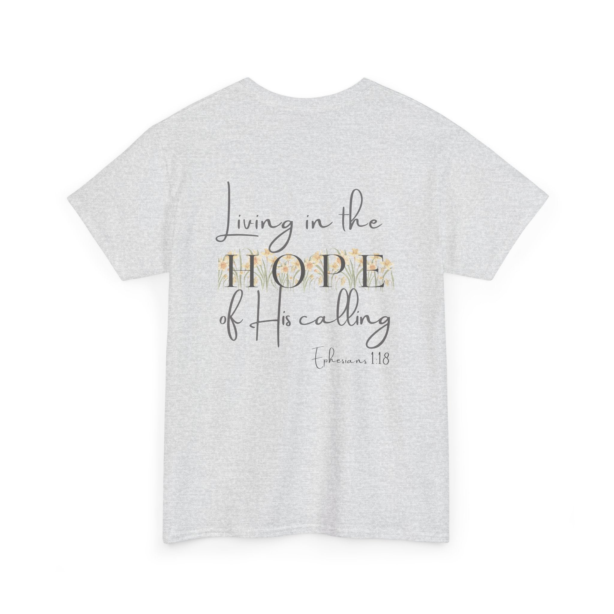 Ash Gray Back of Christian t-shirt displaying the phrase "Living in the Hope of His Calling" with floral daffodil artwork and Ephesians 1:18 scripture reference.