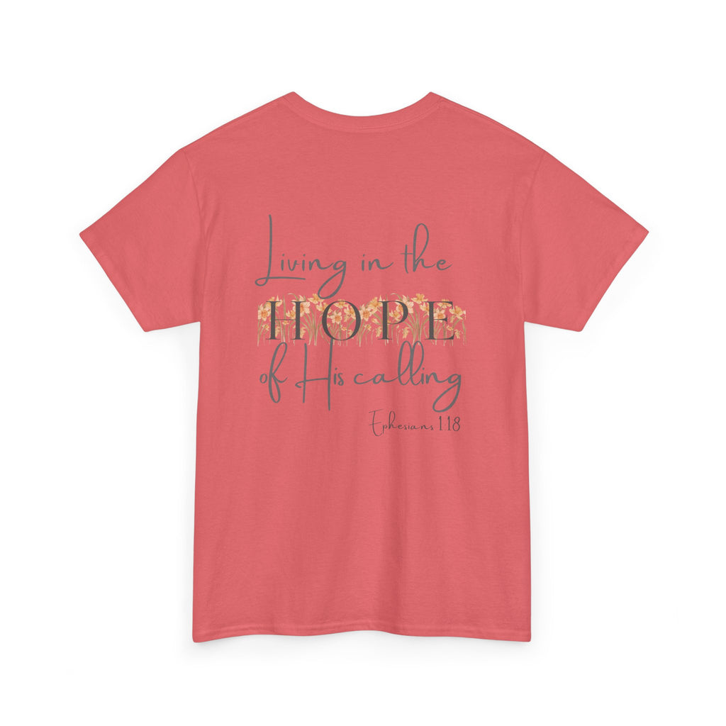 Coral Back of Christian t-shirt displaying the phrase "Living in the Hope of His Calling" with floral daffodil artwork and Ephesians 1:18 scripture reference.