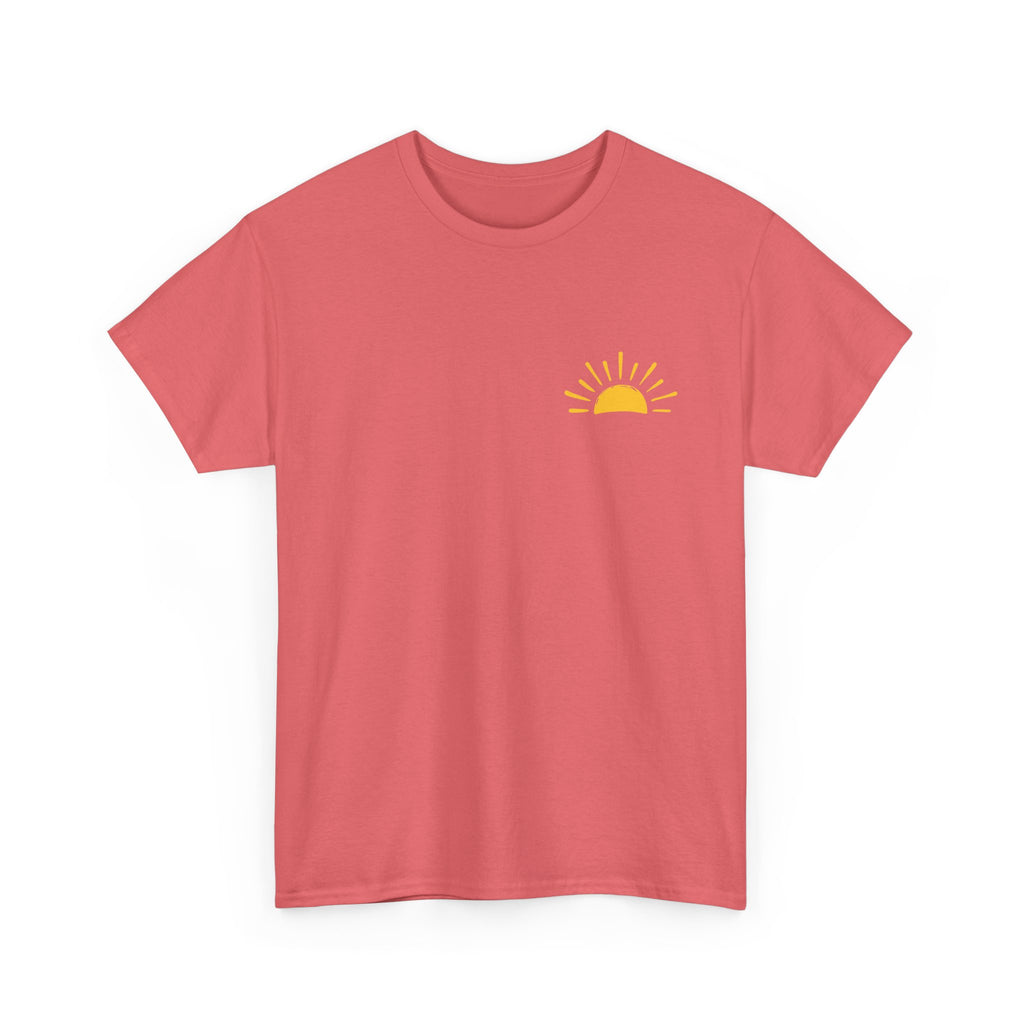 Front of Coral Christian t-shirt with yellow sunshine graphic and “Be Their Light” John 1:5 Bible verse design.