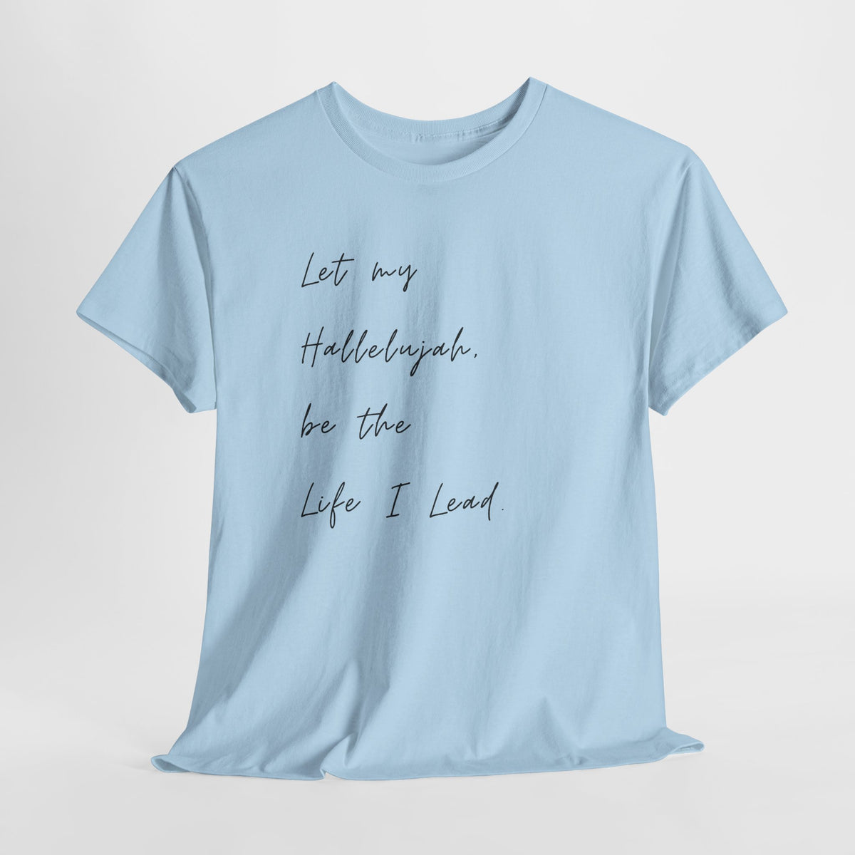 Light blue Christian t-shirt featuring the phrase "Let My Hallelujah Be the Life I Lead" in elegant black script on the front.